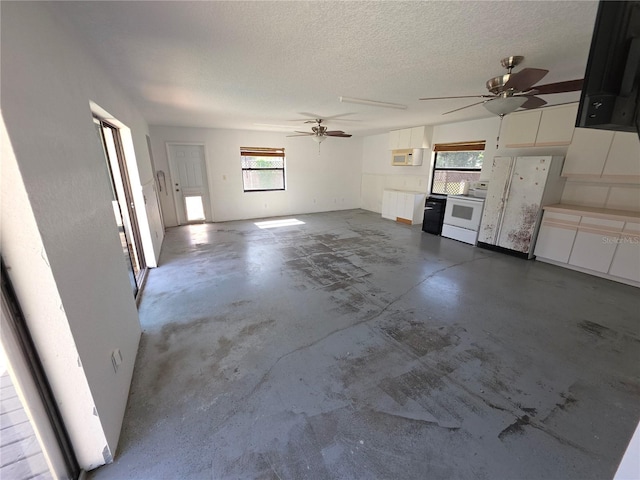 10244 Hoover St, Spring Hill, FL 34608 - unfurnished living room with unfinished concrete flooring, a ceiling fan, and a textured ceiling