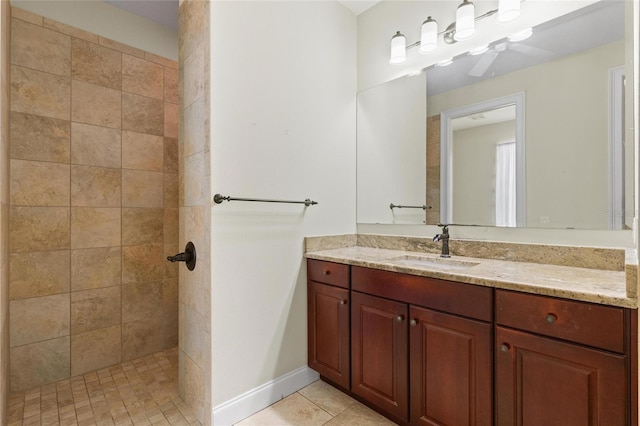 1010 Teal Pointe, Tarpon Springs, FL 34689 - bathroom with vanity, a tile shower, and tile patterned flooring
