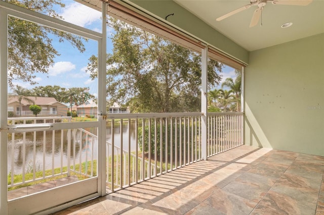 1010 Teal Pointe, Tarpon Springs, FL 34689 - unfurnished sunroom featuring a water view