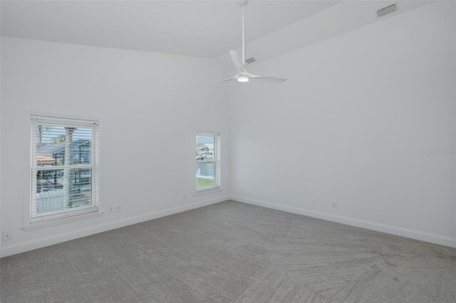3150 Trident Ter, New Port Richey, FL 34652 - spare room featuring carpet floors, ceiling fan, and high vaulted ceiling
