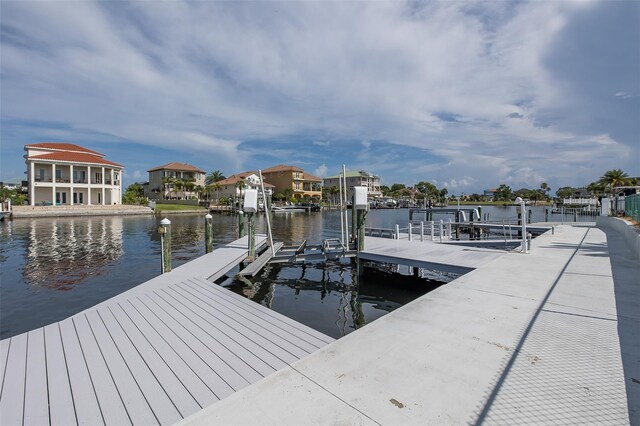 3150 Trident Ter, New Port Richey, FL 34652 - dock with a water view, boat lift, and a residential view