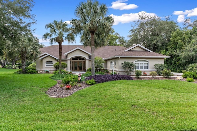 690 E Jenkins Ct, Hernando, FL 34442 - rear view of property featuring french doors, stucco siding, a lawn, and roof with shingles