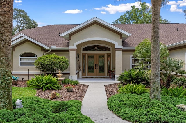 690 E Jenkins Ct, Hernando, FL 34442 - doorway to property with french doors, stucco siding, and a shingled roof