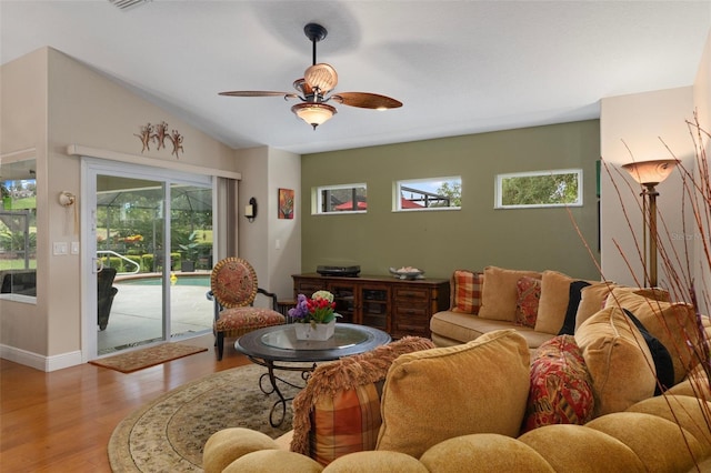 690 E Jenkins Ct, Hernando, FL 34442 - living room with a ceiling fan, healthy amount of natural light, light wood-type flooring, and vaulted ceiling