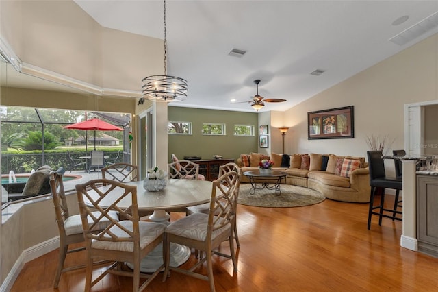 690 E Jenkins Ct, Hernando, FL 34442 - dining room with lofted ceiling, a ceiling fan, and light wood-style floors