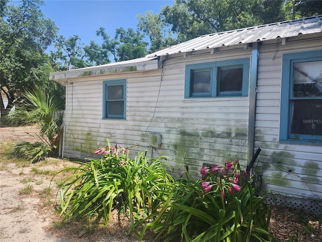 3415 N 51st St, Tampa, FL 33619 - view of side of property with metal roof