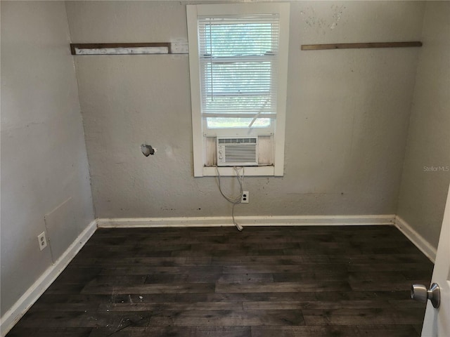 3415 N 51st St, Tampa, FL 33619 - spare room featuring dark wood finished floors, baseboards, and cooling unit