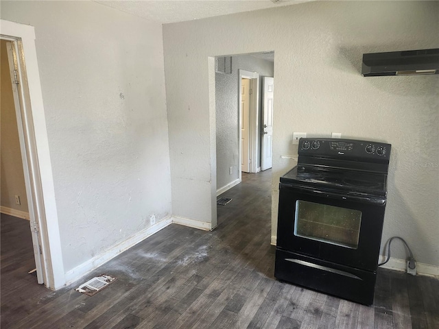 3415 N 51st St, Tampa, FL 33619 - kitchen with black range with electric cooktop, range hood, wood finished floors, and baseboards