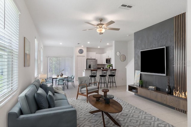 8305 Crescent Oaks Dr, New Port Richey, FL 34655 - living area with a ceiling fan, light tile patterned floors, and recessed lighting