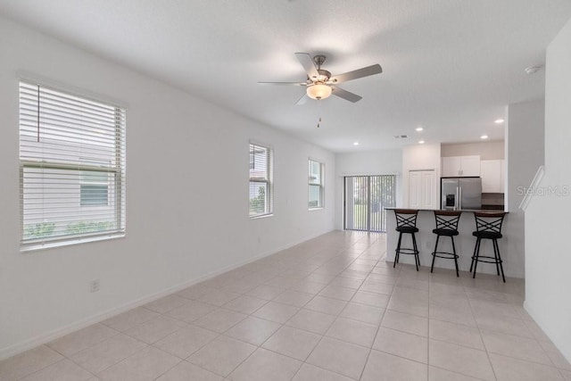 8305 Crescent Oaks Dr, New Port Richey, FL 34655 - living area with ceiling fan, light tile patterned floors, and recessed lighting