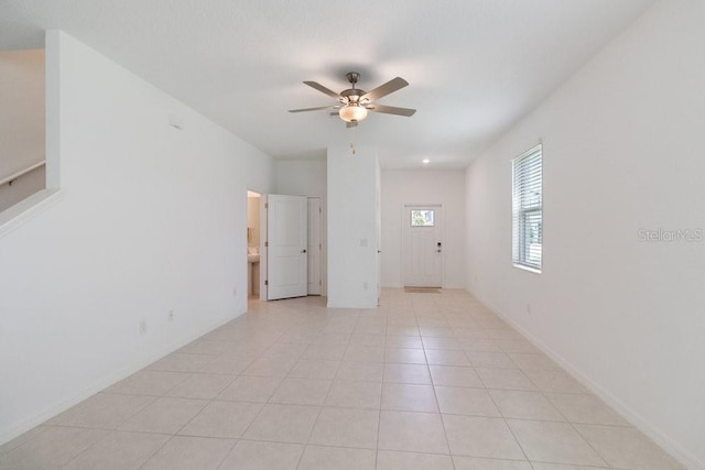 8305 Crescent Oaks Dr, New Port Richey, FL 34655 - empty room with ceiling fan and light tile patterned floors