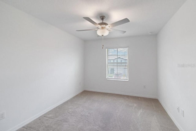 8305 Crescent Oaks Dr, New Port Richey, FL 34655 - spare room featuring ceiling fan and light colored carpet