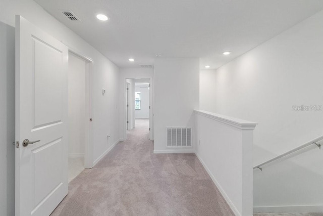 8305 Crescent Oaks Dr, New Port Richey, FL 34655 - hallway featuring an upstairs landing, carpet floors, and recessed lighting