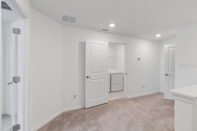 8305 Crescent Oaks Dr, New Port Richey, FL 34655 - unfurnished room with washer / clothes dryer, light colored carpet, and recessed lighting