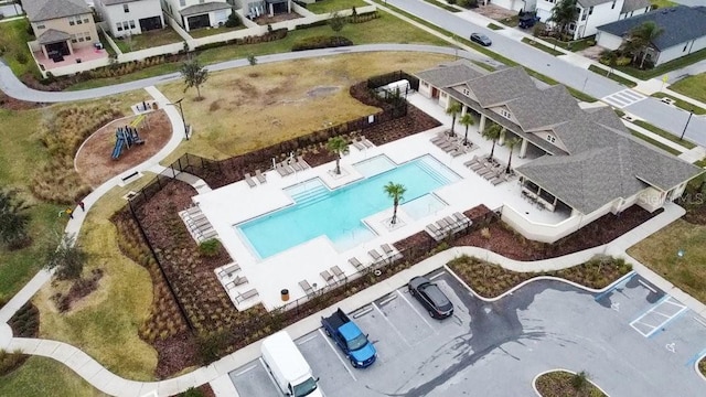8305 Crescent Oaks Dr, New Port Richey, FL 34655 - aerial perspective of suburban area with a pool
