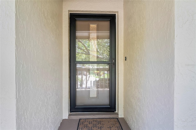 13009 Wedgewood Way Unit 63-D, Hudson, FL 34667 - entrance to property with stucco siding