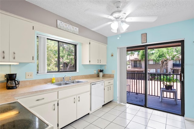 13009 Wedgewood Way Unit 63-D, Hudson, FL 34667 - kitchen featuring white dishwasher, light countertops, a textured ceiling, ceiling fan, and electric range