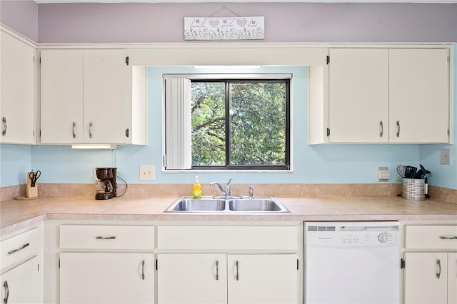 13009 Wedgewood Way Unit 63-D, Hudson, FL 34667 - kitchen with dishwasher, light countertops, and white cabinetry