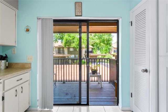 13009 Wedgewood Way Unit 63-D, Hudson, FL 34667 - doorway to outside featuring light tile patterned floors