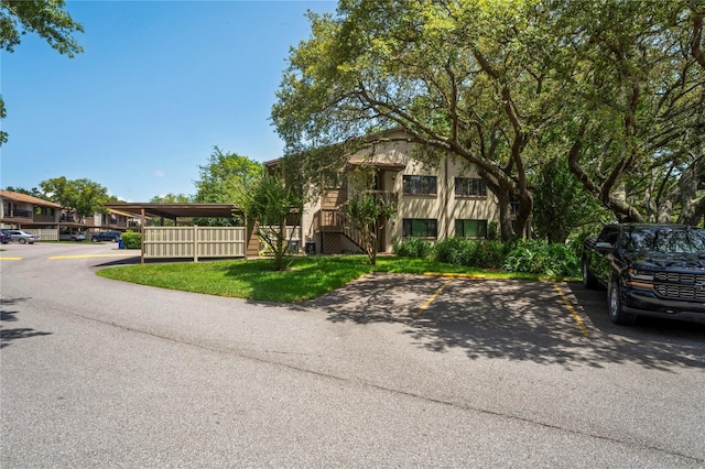 13009 Wedgewood Way Unit 63-D, Hudson, FL 34667 - view of front of home featuring uncovered parking and stairs