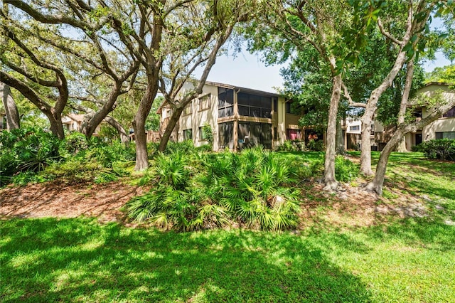 13009 Wedgewood Way Unit 63-D, Hudson, FL 34667 - rear view of property featuring a yard