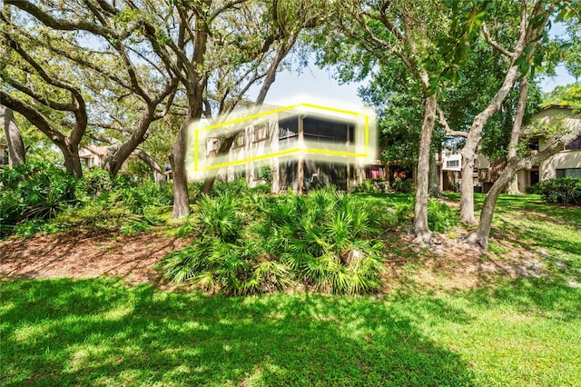 13009 Wedgewood Way Unit 63-D, Hudson, FL 34667 - rear view of property with a lawn