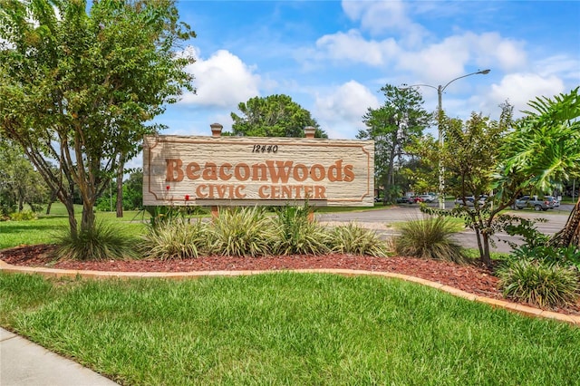 13009 Wedgewood Way Unit 63-D, Hudson, FL 34667 - community sign with a yard