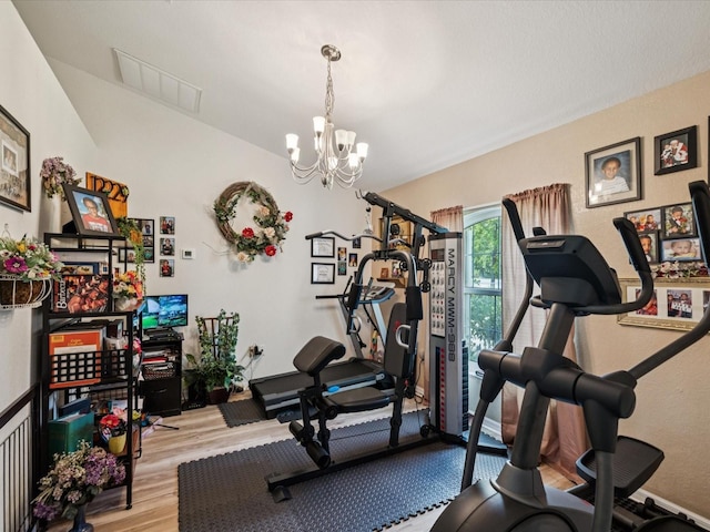 12229 Barnevelde Rd, Weeki Wachee, FL 34614 - workout area featuring wood finished floors and a chandelier