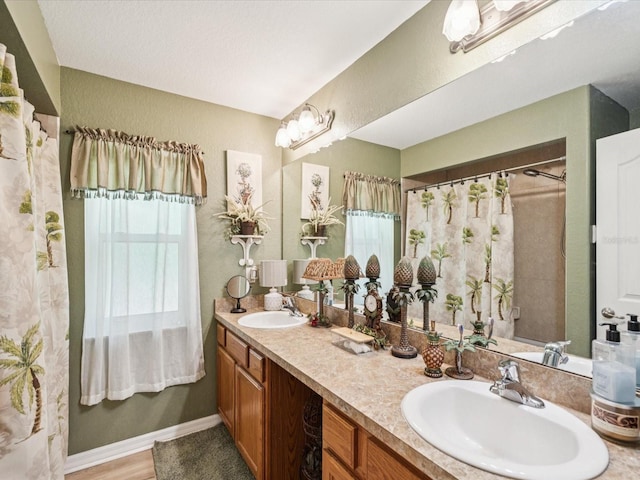 12229 Barnevelde Rd, Weeki Wachee, FL 34614 - full bathroom with double vanity and a textured wall