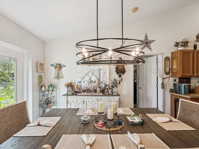 12229 Barnevelde Rd, Weeki Wachee, FL 34614 - dining area featuring a chandelier