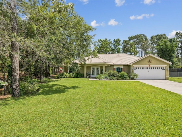 12229 Barnevelde Rd, Weeki Wachee, FL 34614 - ranch-style house featuring french doors, stucco siding, concrete driveway, a garage, and metal roof