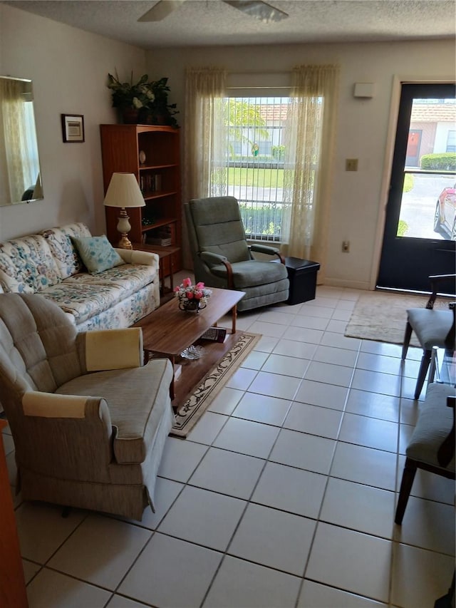 6050 Chesham Dr Unit 3, New Port Richey, FL 34653 - living room with a textured ceiling and light tile patterned flooring