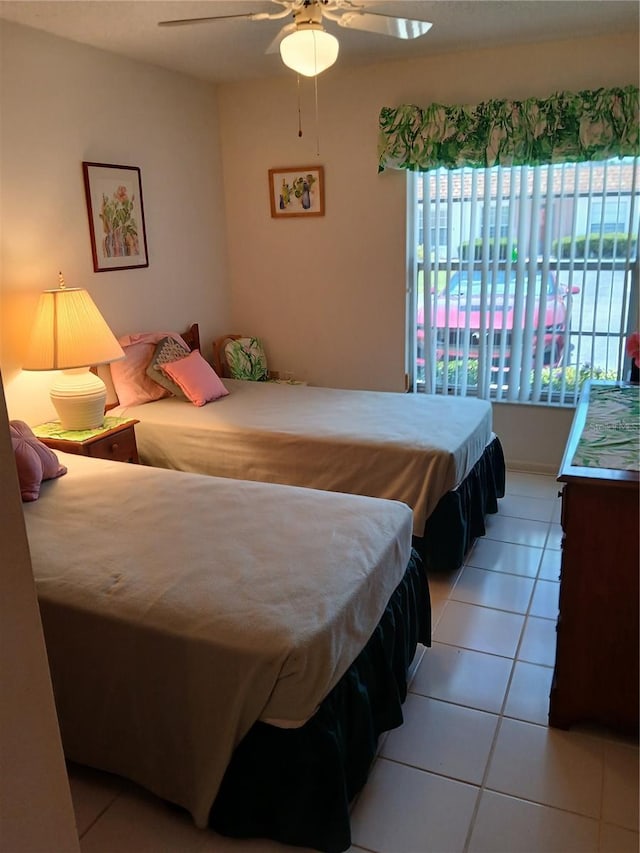6050 Chesham Dr Unit 3, New Port Richey, FL 34653 - bedroom featuring light tile patterned flooring and ceiling fan