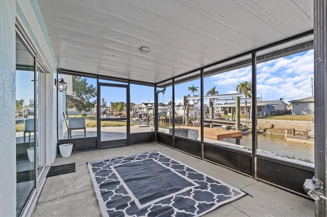 13821 Judy Ave, Hudson, FL 34667 - unfurnished sunroom with a water view, plenty of natural light, and a residential view