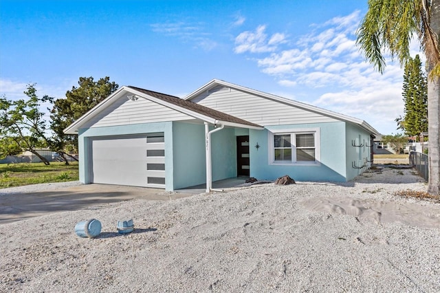13821 Judy Ave, Hudson, FL 34667 - single story home featuring an attached garage, driveway, and stucco siding
