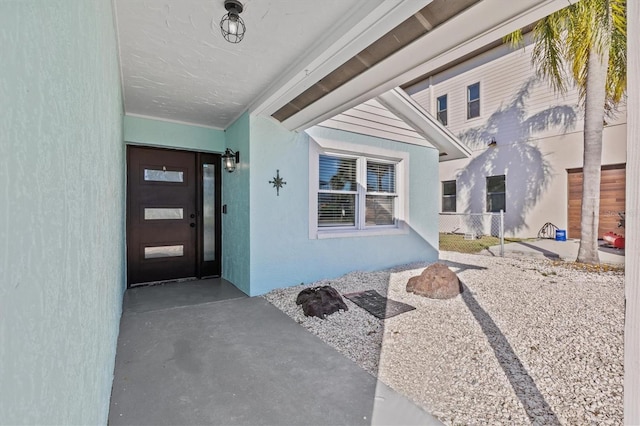13821 Judy Ave, Hudson, FL 34667 - property entrance with stucco siding