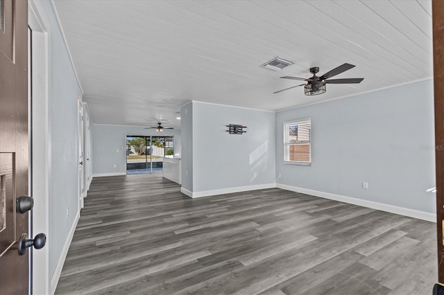 13821 Judy Ave, Hudson, FL 34667 - unfurnished living room with a ceiling fan, crown molding, dark wood-style floors, and baseboards