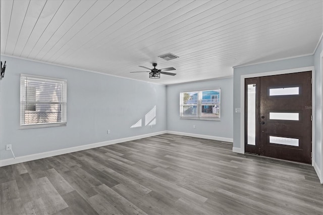 13821 Judy Ave, Hudson, FL 34667 - foyer entrance featuring wooden ceiling, dark wood-style flooring, baseboards, ceiling fan, and crown molding