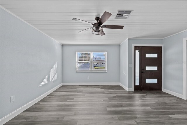 13821 Judy Ave, Hudson, FL 34667 - entrance foyer featuring ornamental molding, ceiling fan, baseboards, and wood finished floors