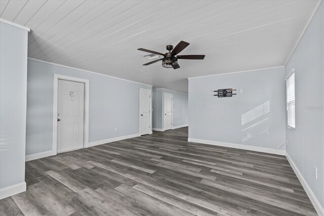 13821 Judy Ave, Hudson, FL 34667 - unfurnished living room with ornamental molding, ceiling fan, baseboards, and dark wood finished floors