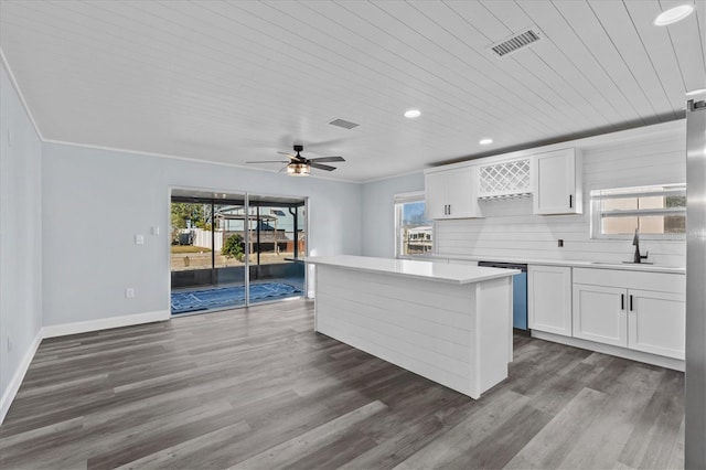 13821 Judy Ave, Hudson, FL 34667 - kitchen featuring white cabinets, light countertops, plenty of natural light, wooden ceiling, and recessed lighting