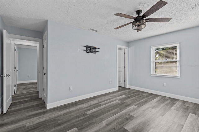 13821 Judy Ave, Hudson, FL 34667 - spare room featuring a textured ceiling, a ceiling fan, wood finished floors, and baseboards