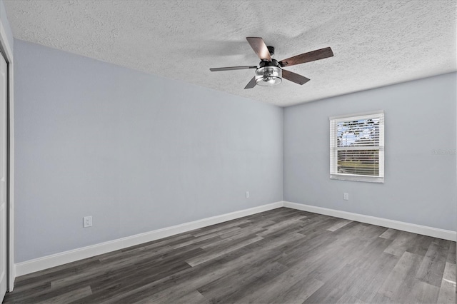13821 Judy Ave, Hudson, FL 34667 - spare room with a textured ceiling, dark wood-style flooring, a ceiling fan, and baseboards