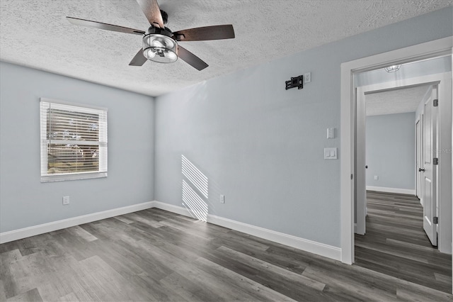 13821 Judy Ave, Hudson, FL 34667 - spare room featuring a textured ceiling, wood finished floors, ceiling fan, and baseboards