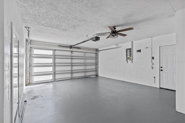 13821 Judy Ave, Hudson, FL 34667 - garage with a garage door opener and a ceiling fan