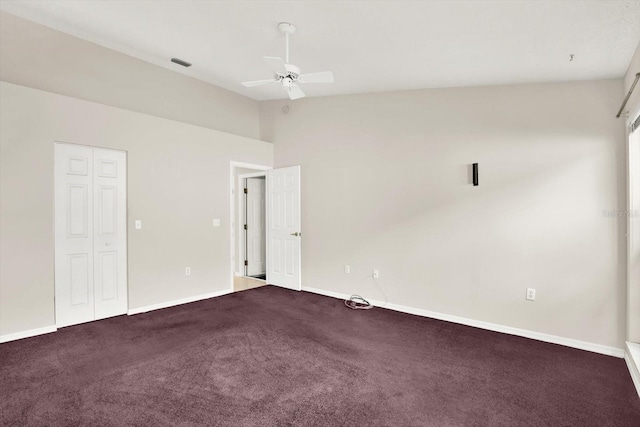 10935 New Brighton Ct, New Port Richey, FL 34654 - unfurnished room with lofted ceiling, a ceiling fan, and dark colored carpet