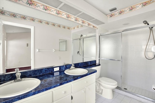 10935 New Brighton Ct, New Port Richey, FL 34654 - bathroom featuring double vanity, a stall shower, and tile patterned floors