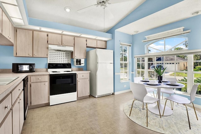 10935 New Brighton Ct, New Port Richey, FL 34654 - kitchen featuring black appliances, under cabinet range hood, light countertops, light brown cabinetry, and a ceiling fan