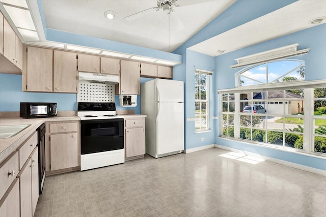 10935 New Brighton Ct, New Port Richey, FL 34654 - kitchen with black appliances, under cabinet range hood, light countertops, ceiling fan, and light brown cabinetry