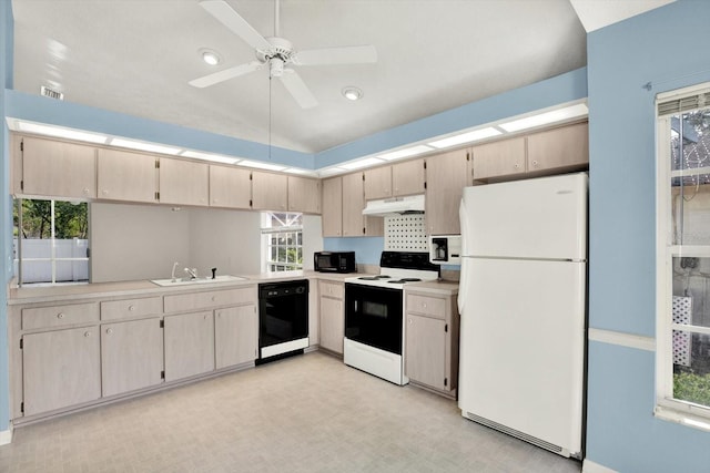 10935 New Brighton Ct, New Port Richey, FL 34654 - kitchen featuring black appliances, under cabinet range hood, light countertops, a ceiling fan, and vaulted ceiling